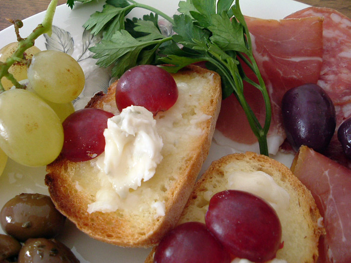 Bruschette and Crostini - crusty bread, topped with Gorgonzola and grapes [Italy]